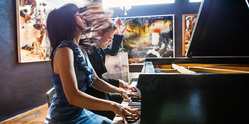 Greg Anderson and Elizabeth Joy Roe playing piano