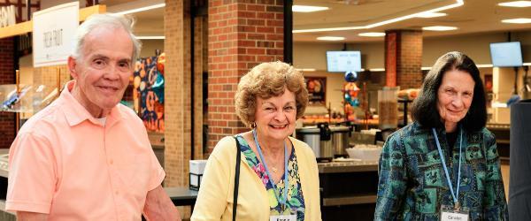 Wheaton Alumni walking in Dining Commons