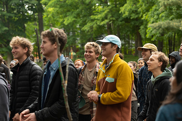 A group of college student in the woods