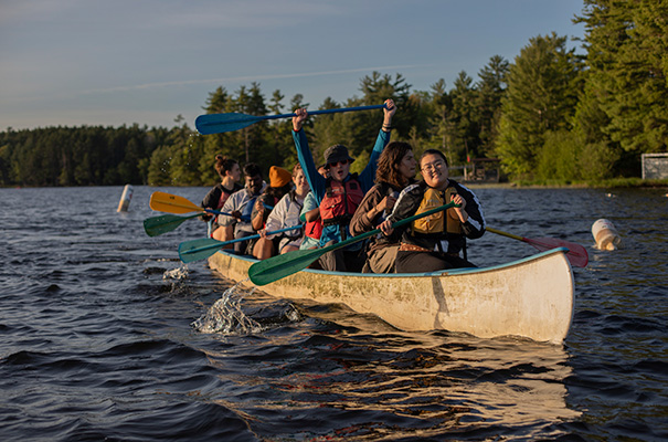 A group of students canoeing