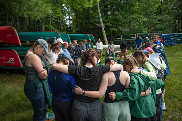 A group of students praying