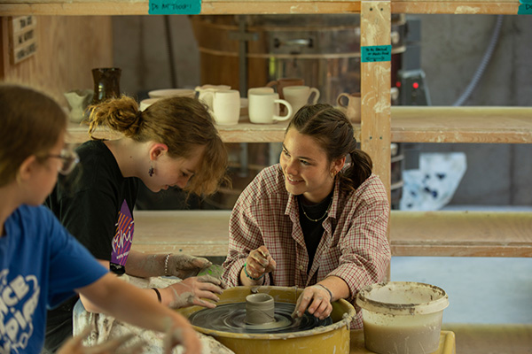 Students working with clay in an art activity