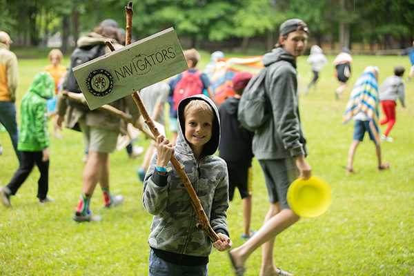 A boy holding a sign